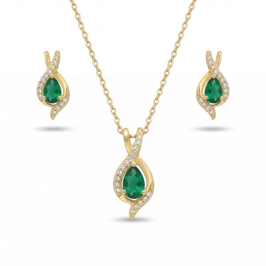 Gold jewelry set with emerald green stones