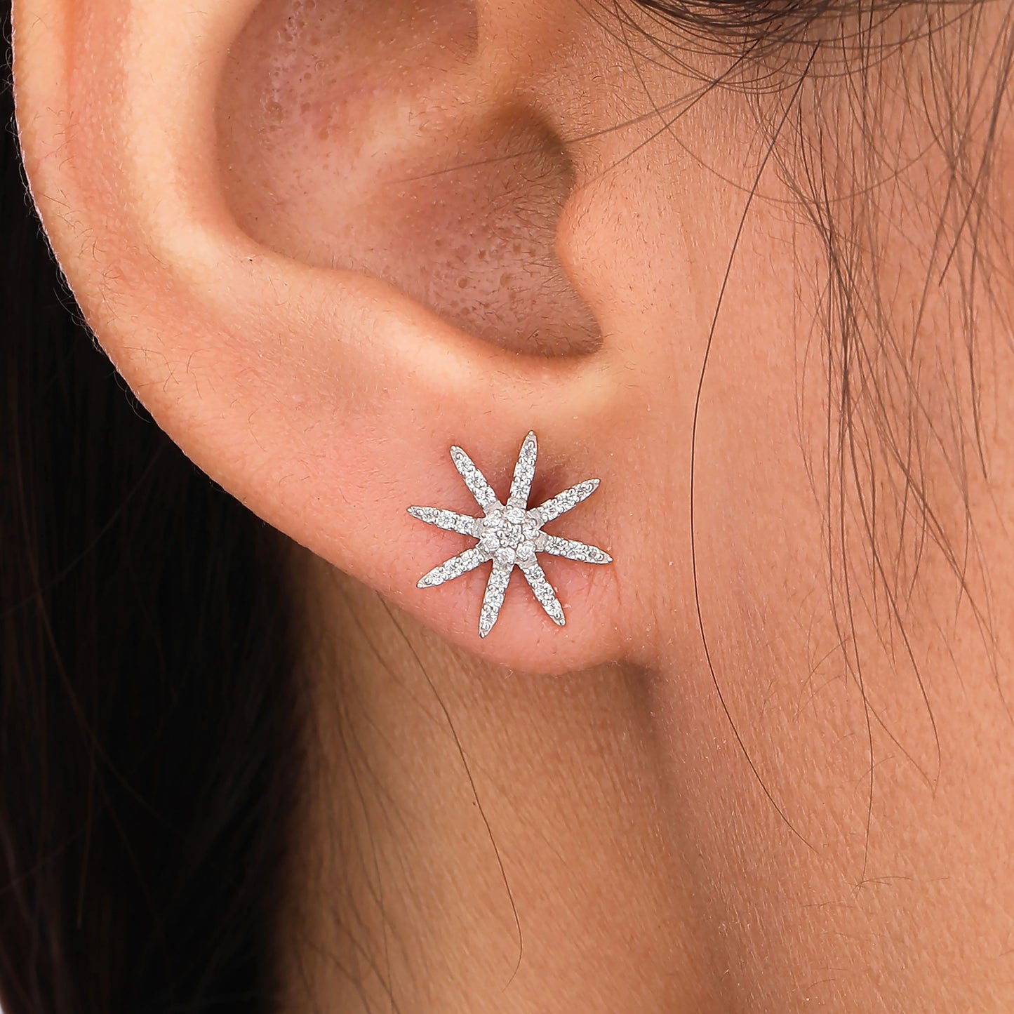 Close-up of a star-shaped earring