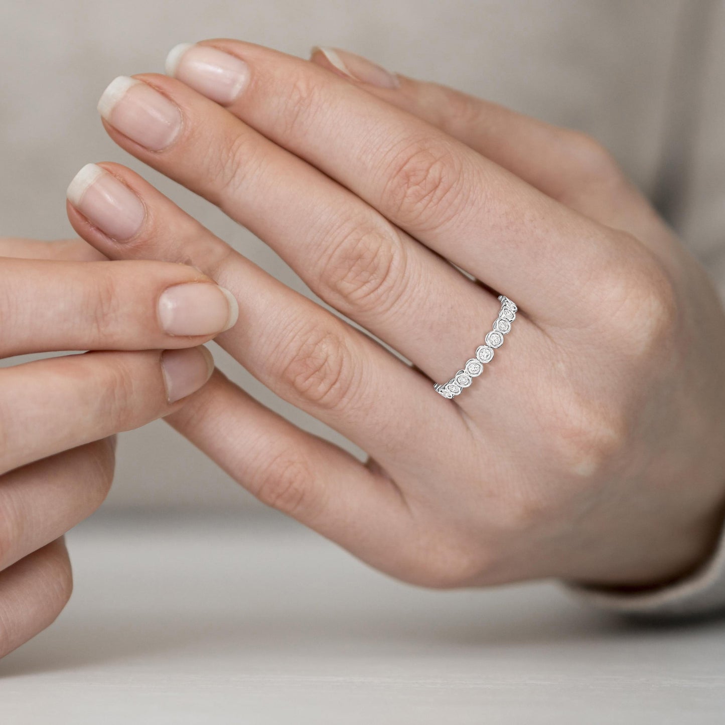 Close-up of a hand wearing a diamond ring