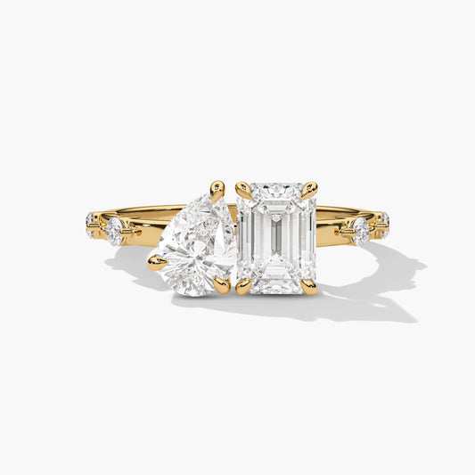 Gold ring with two emerald-cut diamonds
