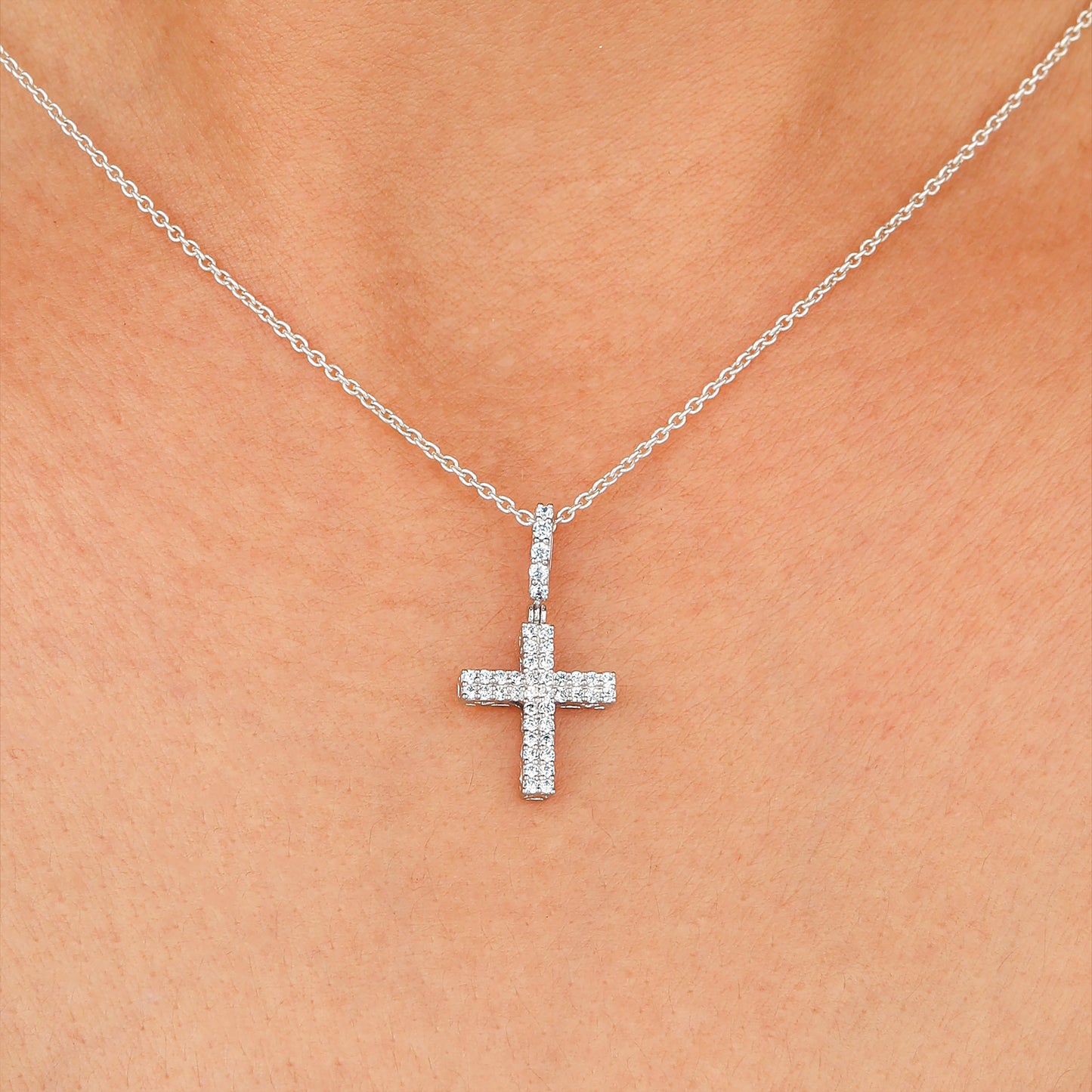 Silver necklace with a clear pendant worn 