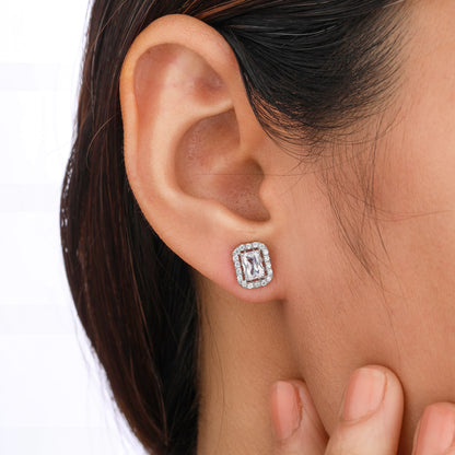 Close-up of an ear wearing a diamond earring 