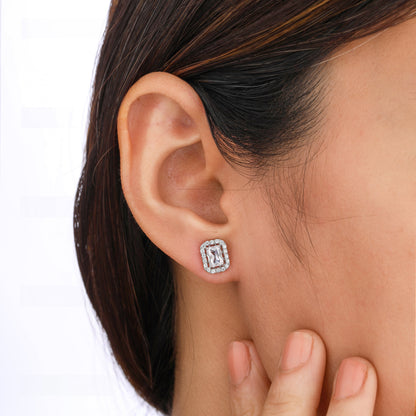 Close-up of an ear wearing a diamond earring