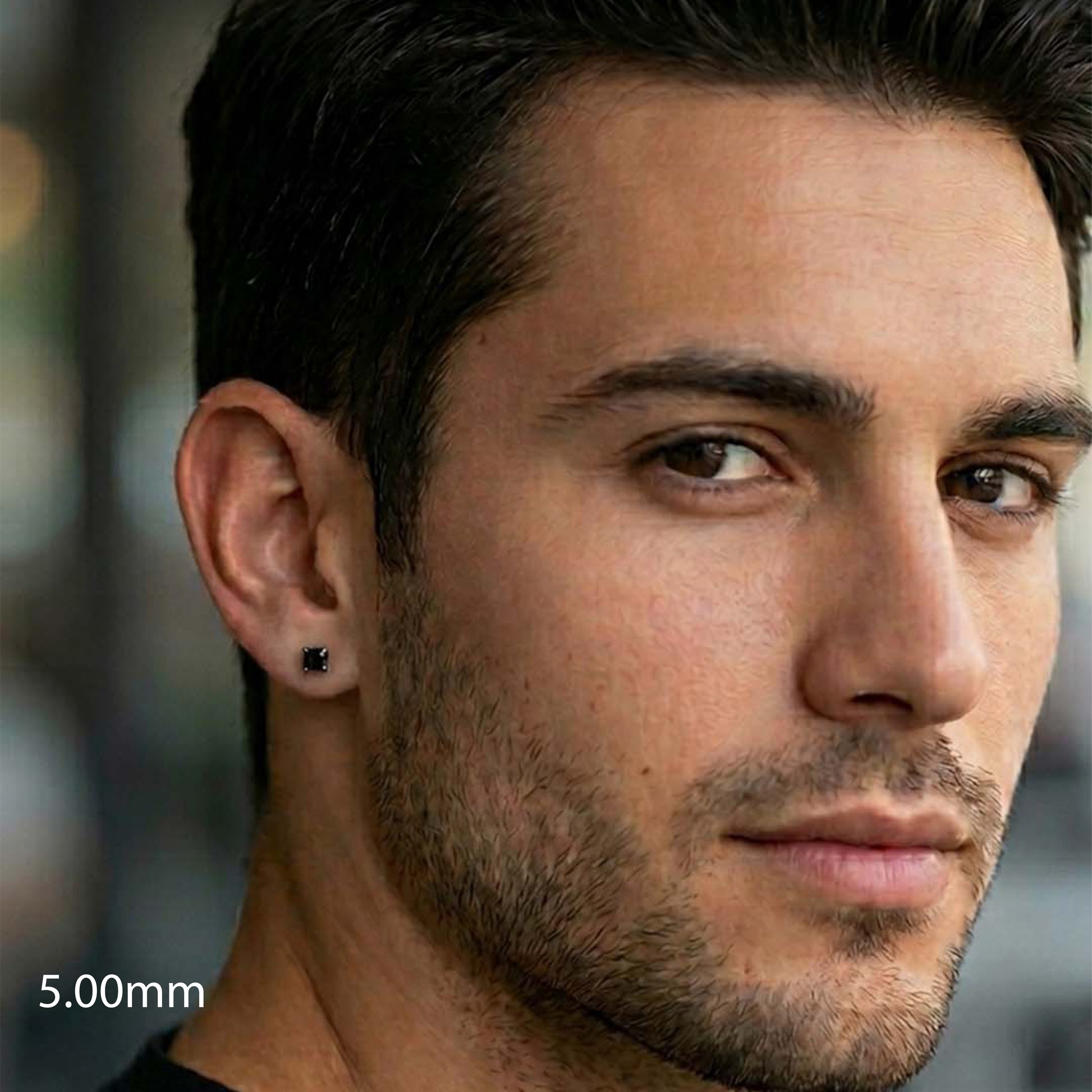 Close-up of a man's face with wearing a black earrings