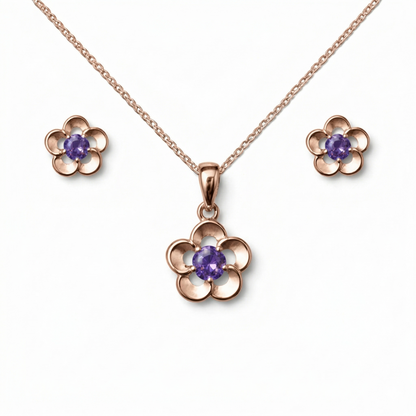 Rose gold flower-shaped jewelry set with purple gemstones 