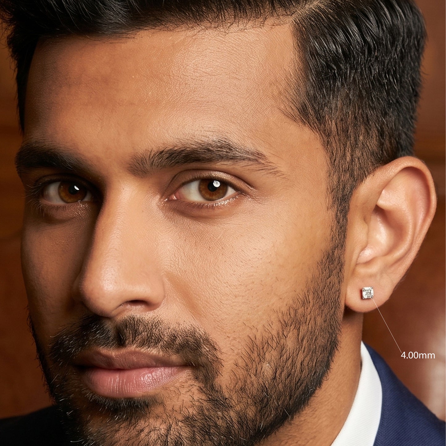 Close-up of a man wearing a diamond earring with a blurred background