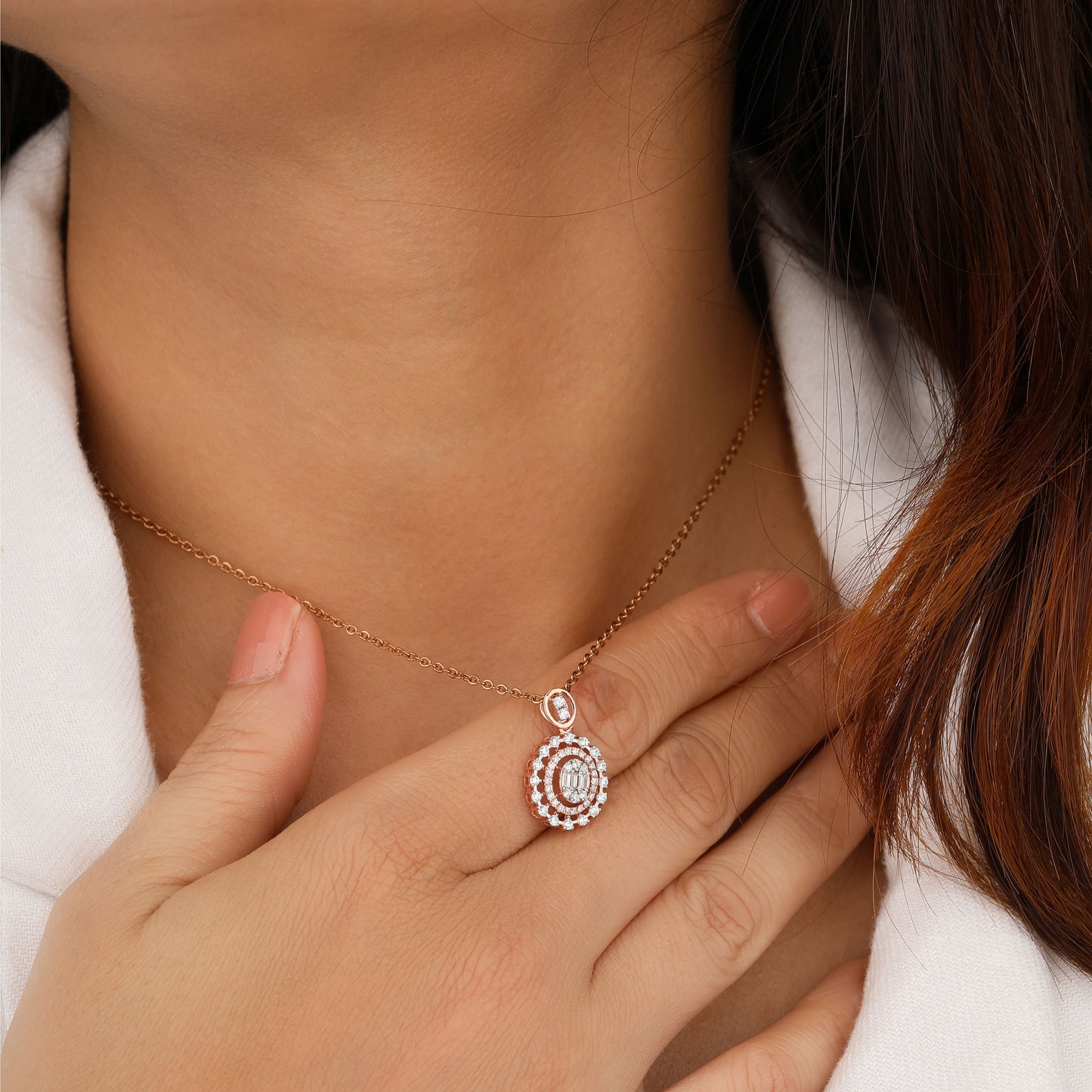 Close-up of a person wearing a delicate necklace 