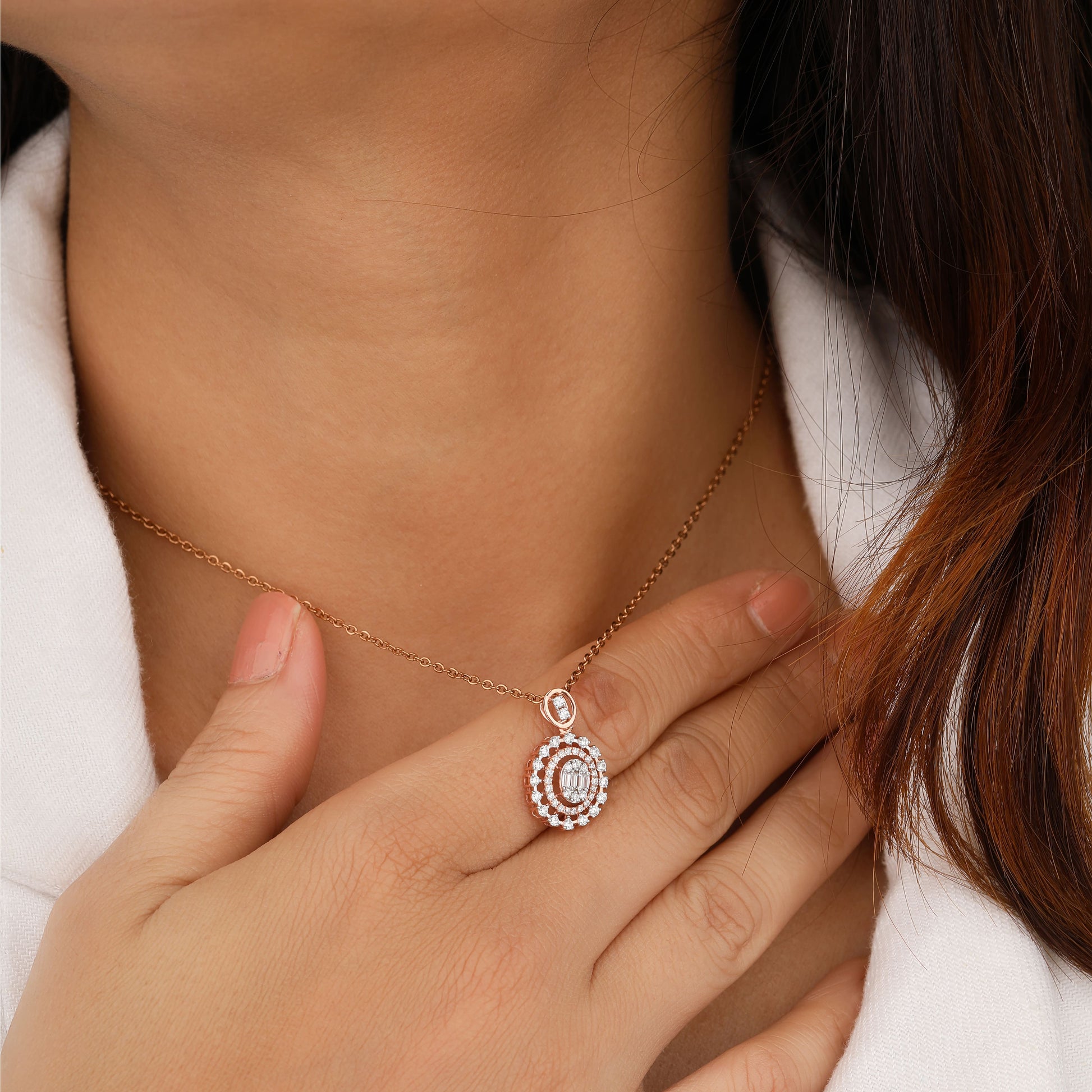 Close-up of a person wearing a delicate necklace 