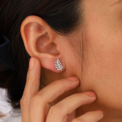 chinar leaf earrings on model ear