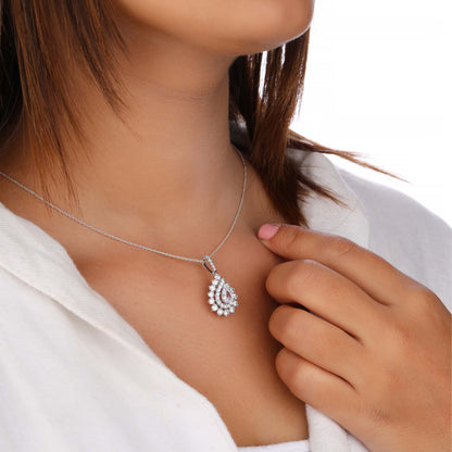 Silver necklace with a teardrop-shaped pendant worn by a person