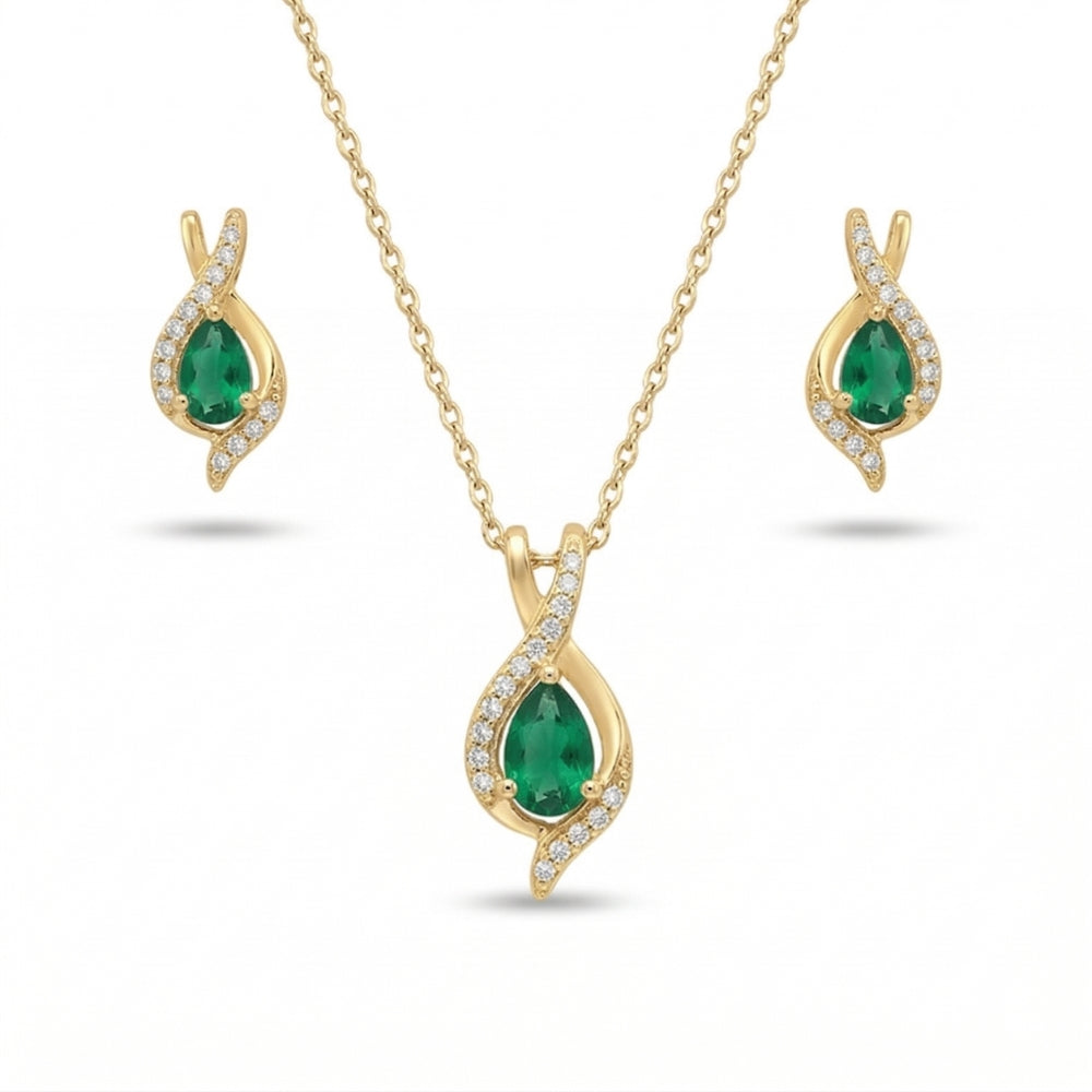 Gold jewelry set with emerald green stones