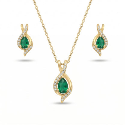 Gold jewelry set with emerald green stones