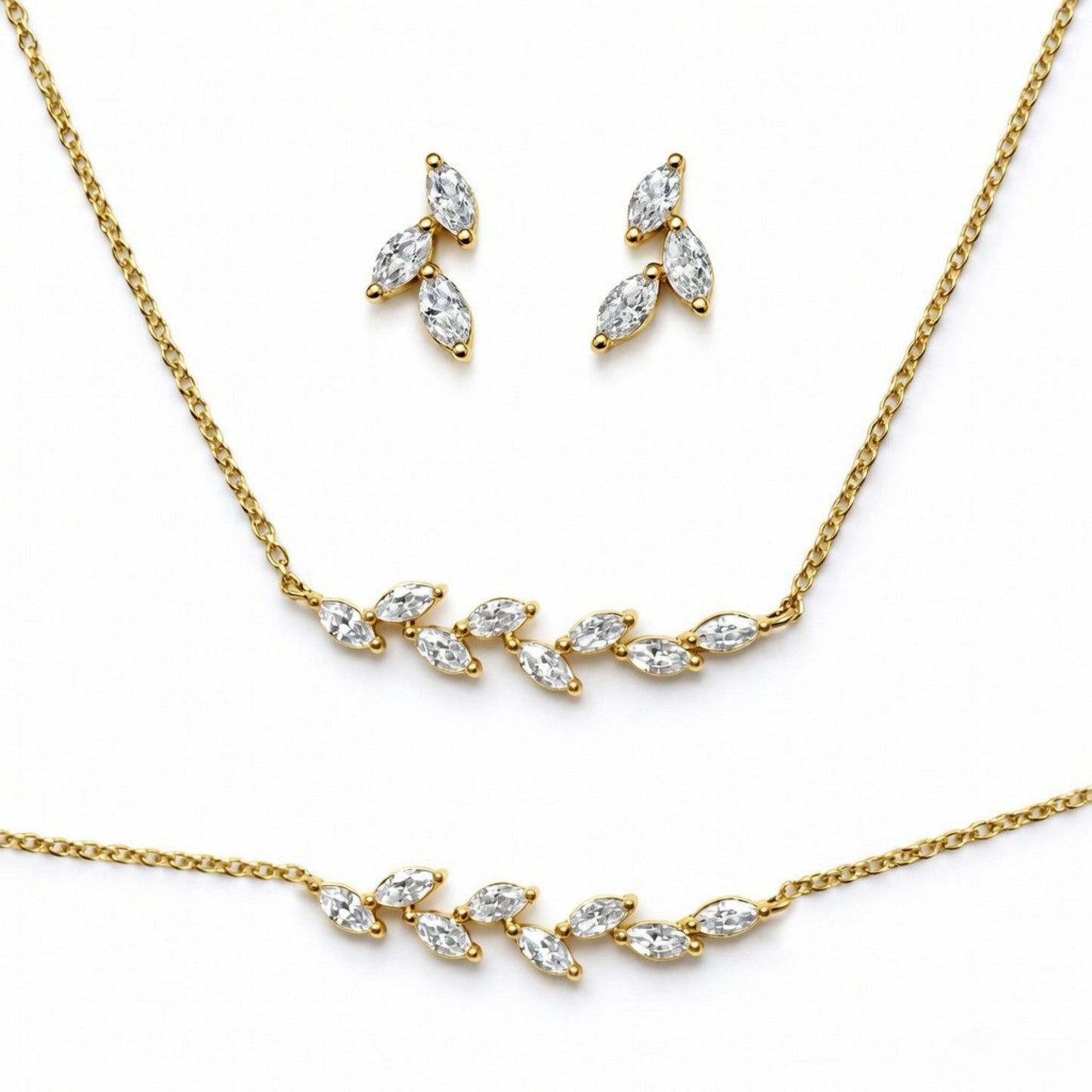 Gold plated necklace and earrings set on a white background