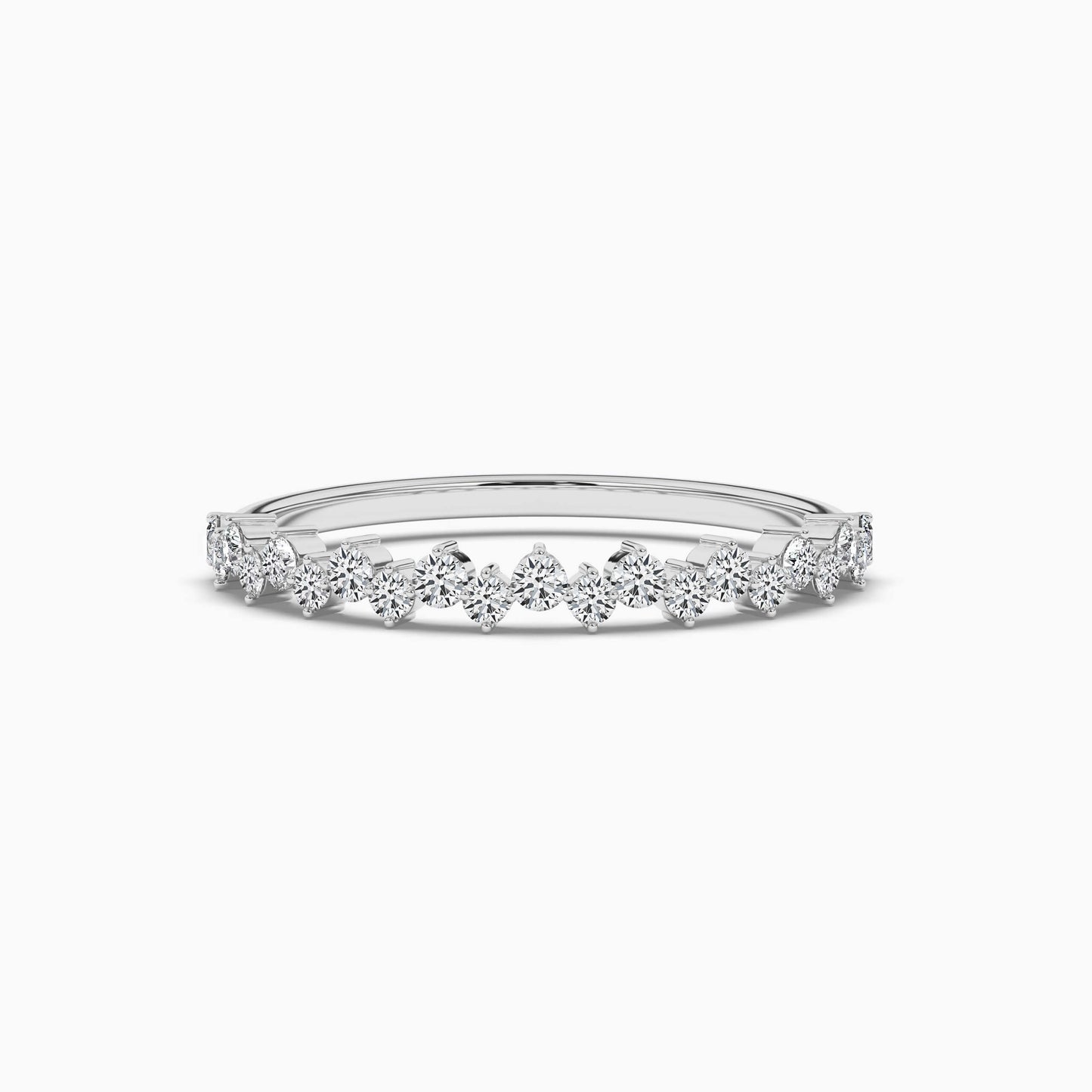 Delicate silver ring with small diamonds on a white background