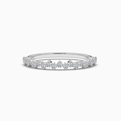 Delicate silver ring with small diamonds on a white background