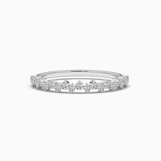 Delicate silver ring with small diamonds on a white background