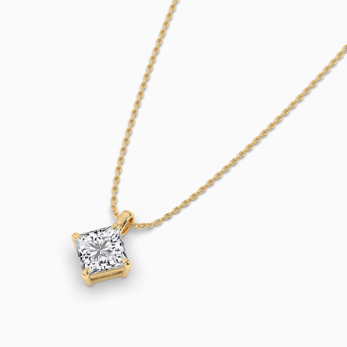 Gold necklace with a diamond pendant on a white background
