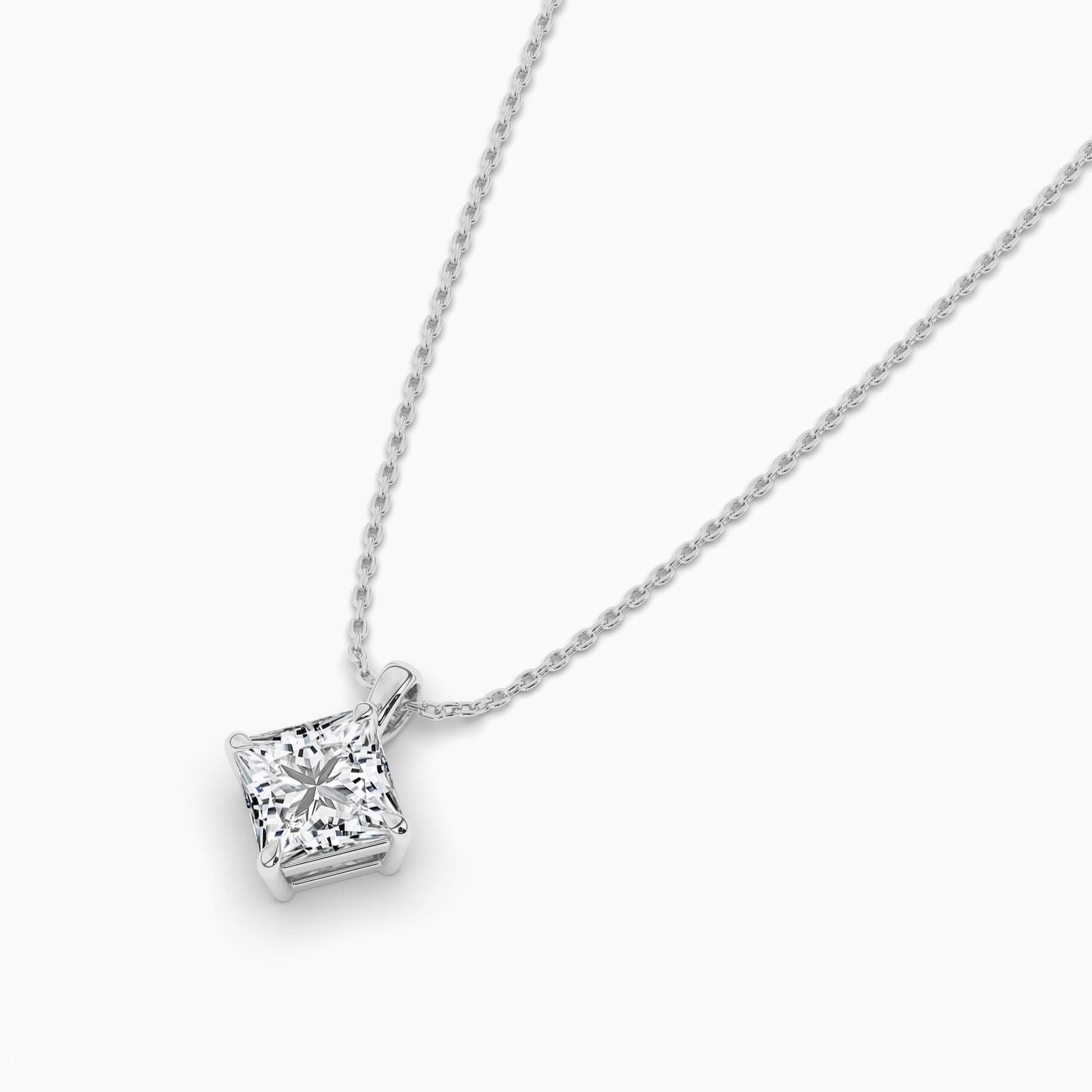 Silver necklace with a square-cut pendant on a white background