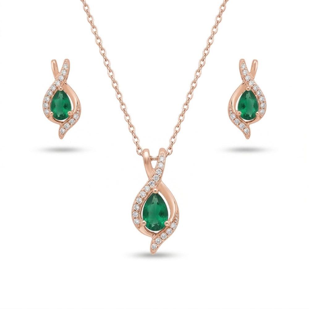 Jewelry set with emerald green gemstones and rose gold 