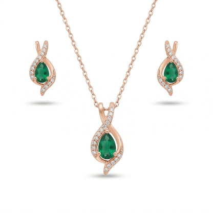 Jewelry set with emerald green gemstones and rose gold 