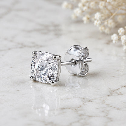 Diamond stud earring on a marble surface