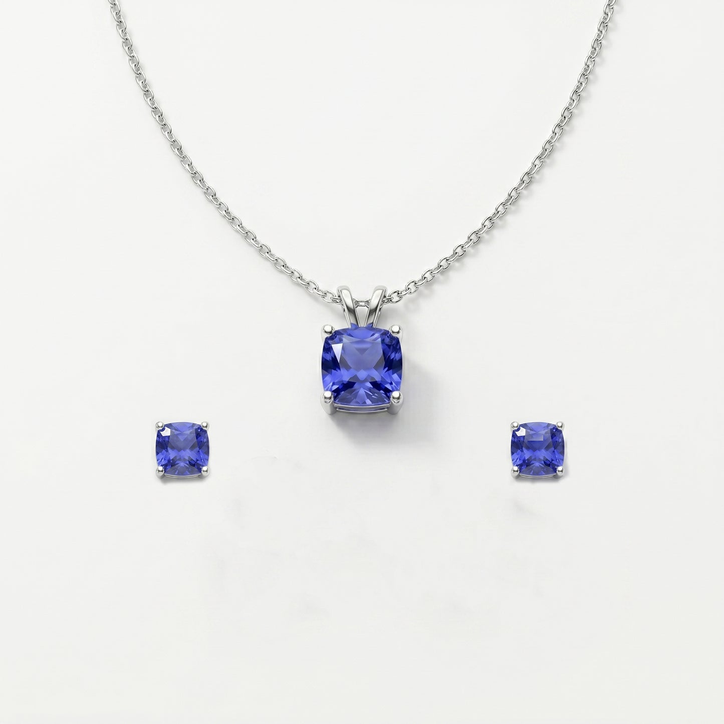 Jewelry set with tanzanite gemstones on a white background