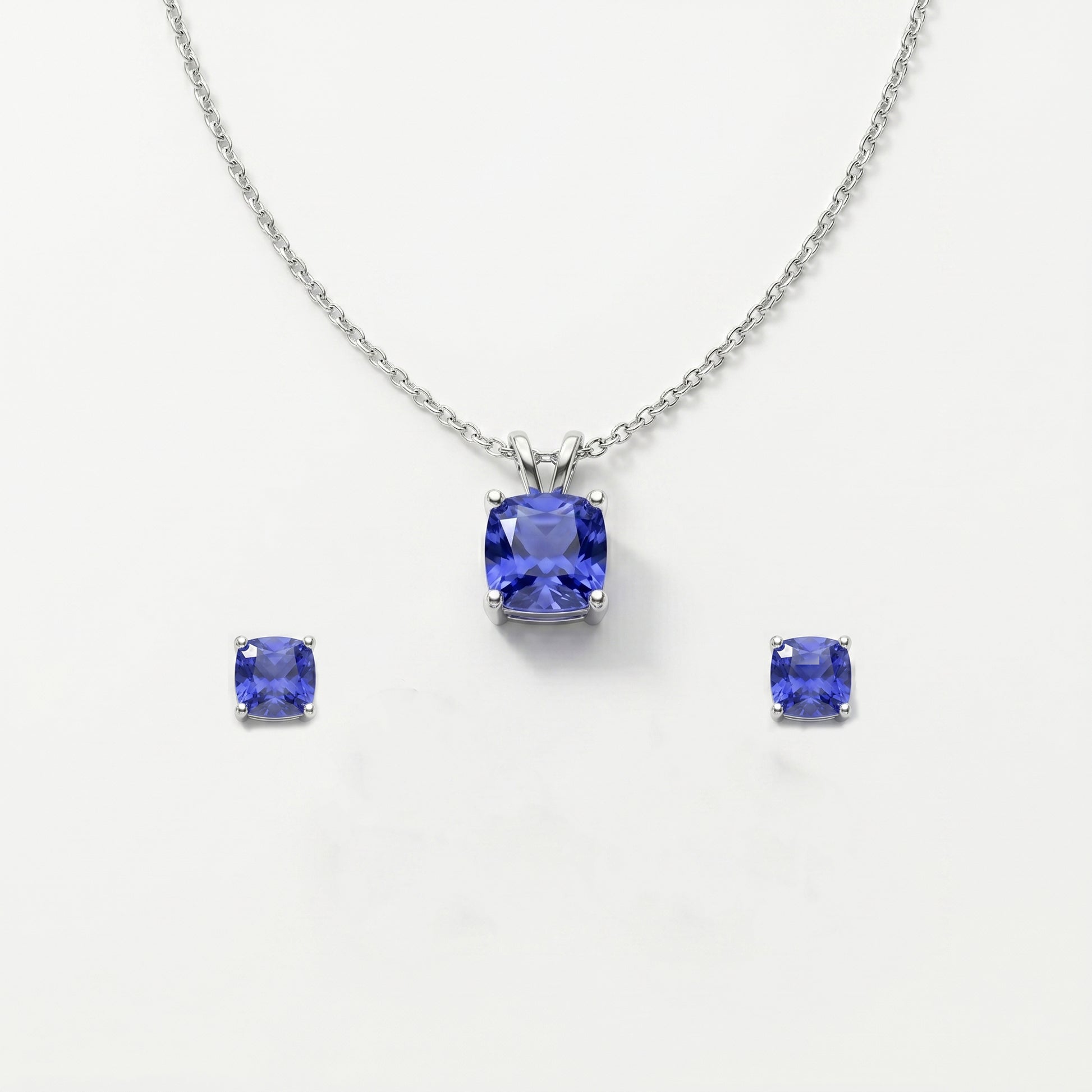 Jewelry set with tanzanite gemstones on a white background