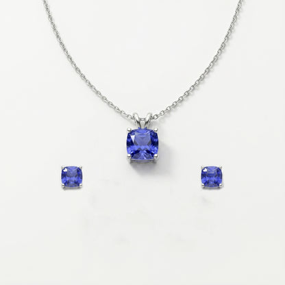 Jewelry set with tanzanite gemstones on a white background