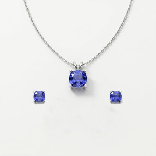 Jewelry set with tanzanite gemstones on a white background