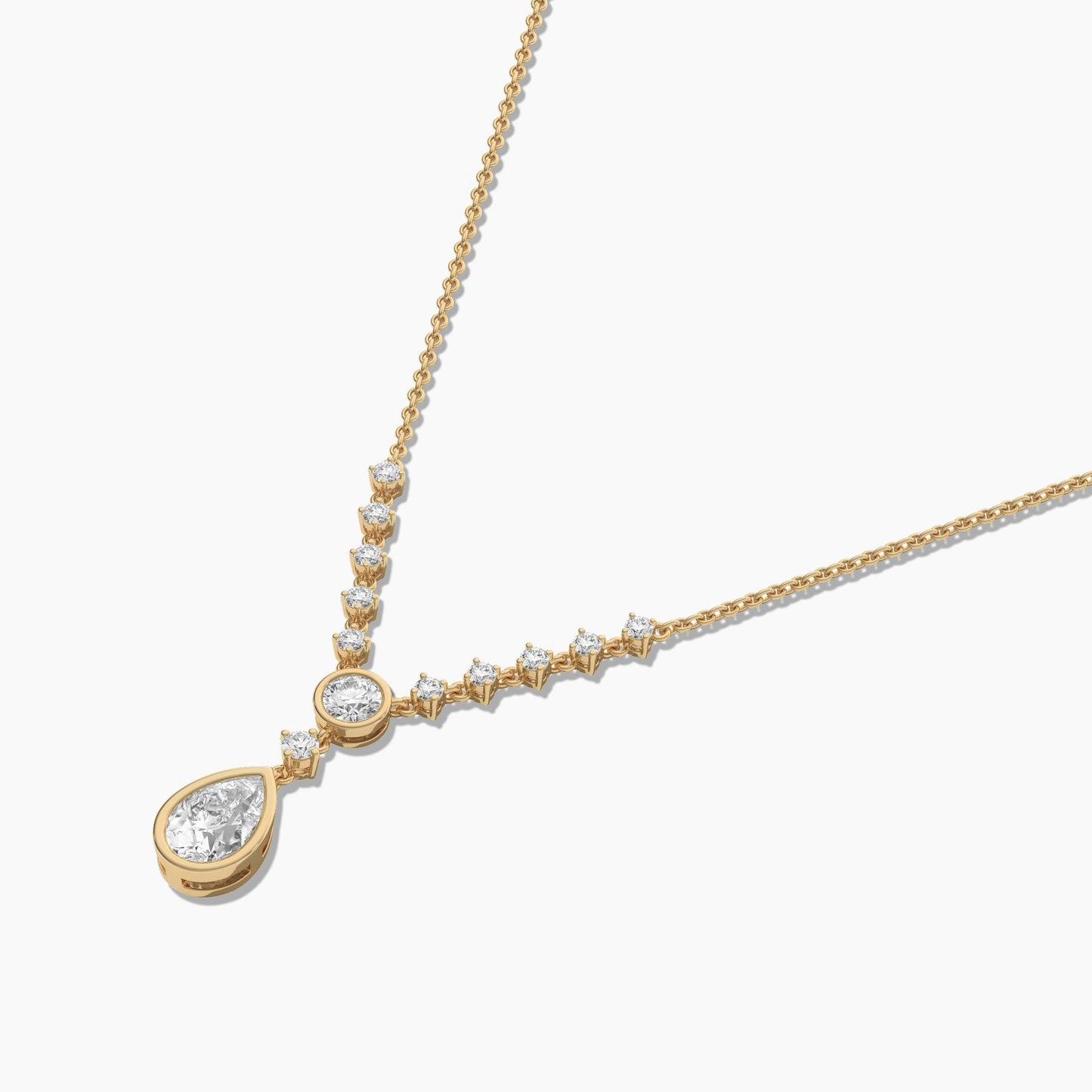 Gold necklace with a teardrop-shaped pendant on a white background