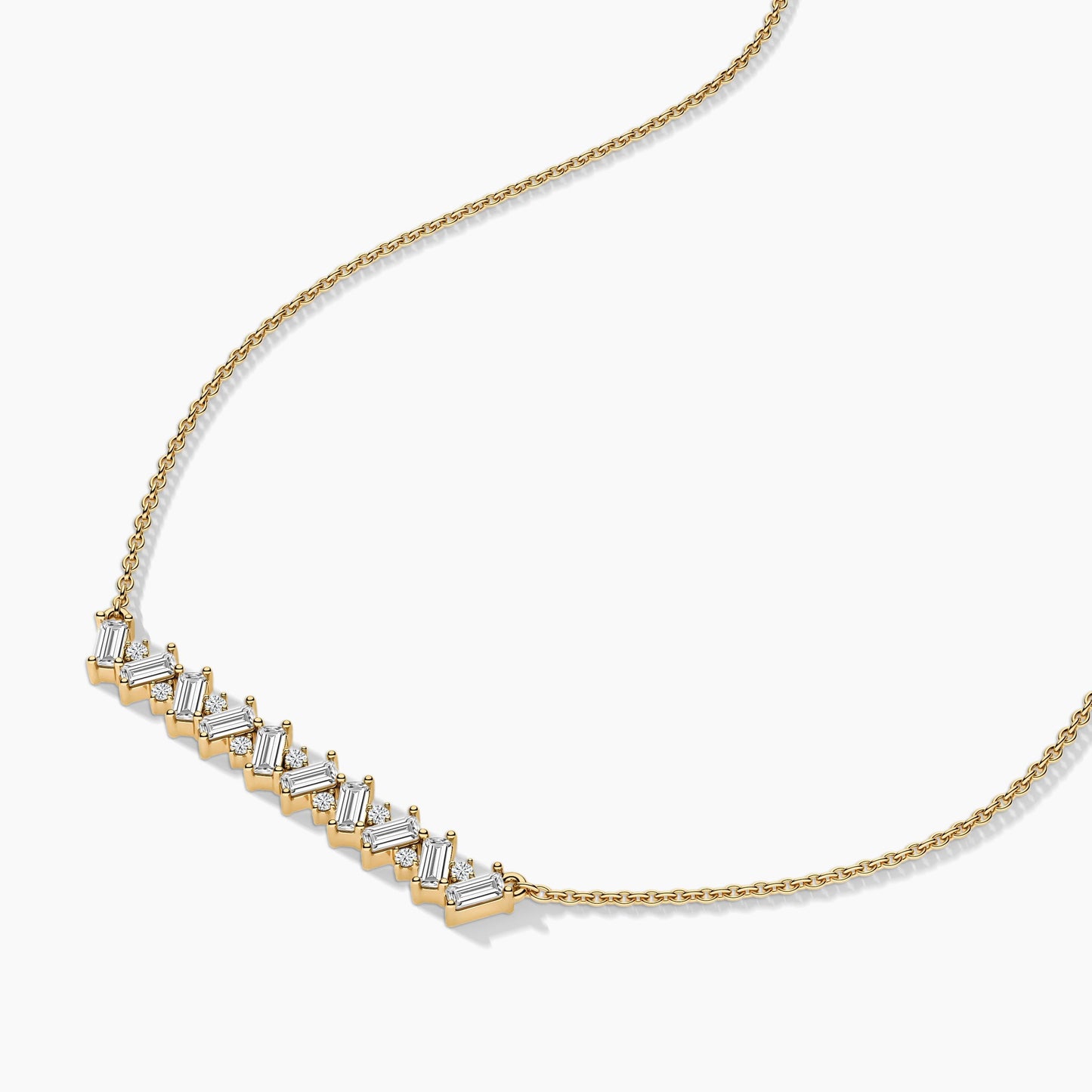 Gold necklace with diamond accents on a white background