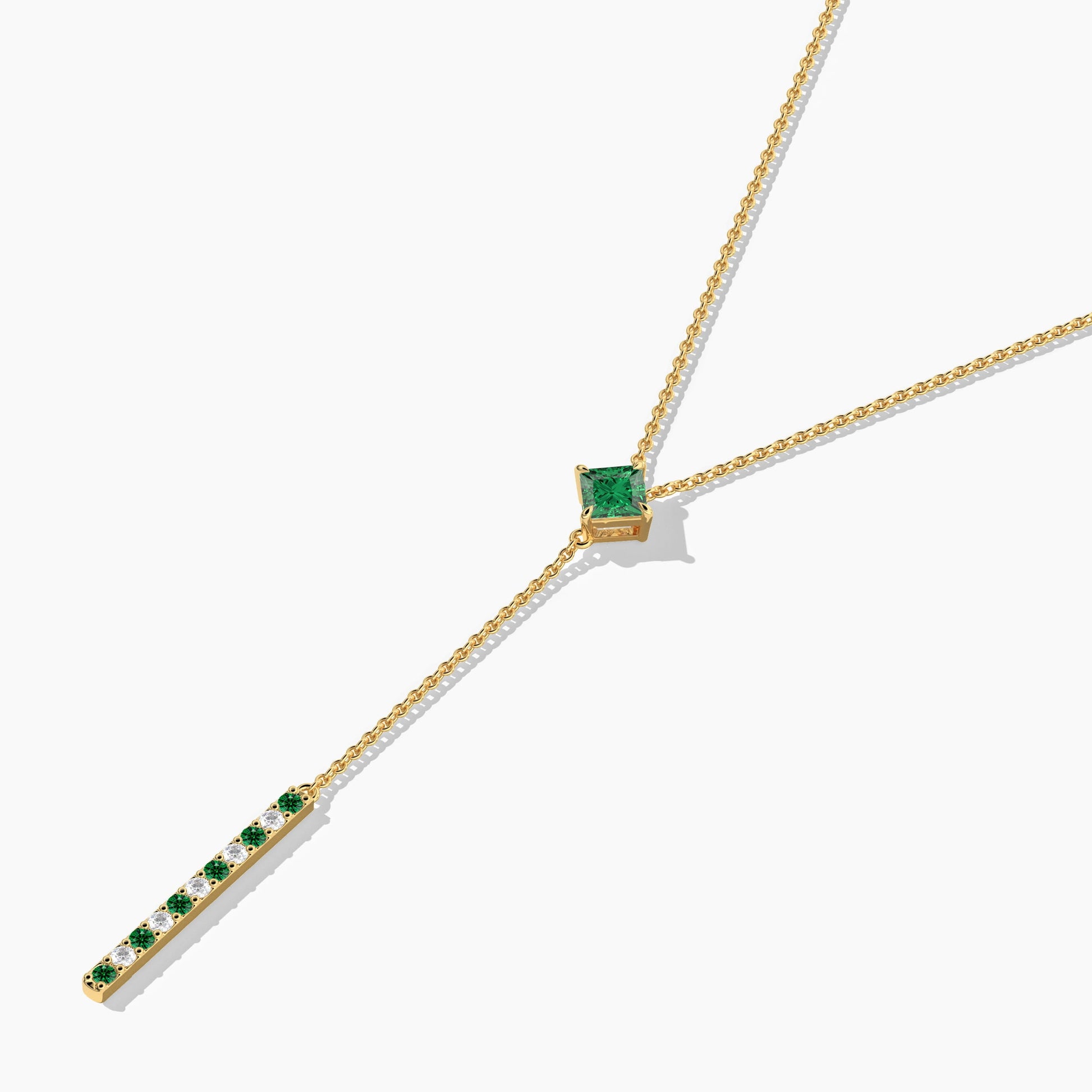 Gold necklace with green gemstones 