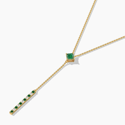 Gold necklace with green gemstones 
