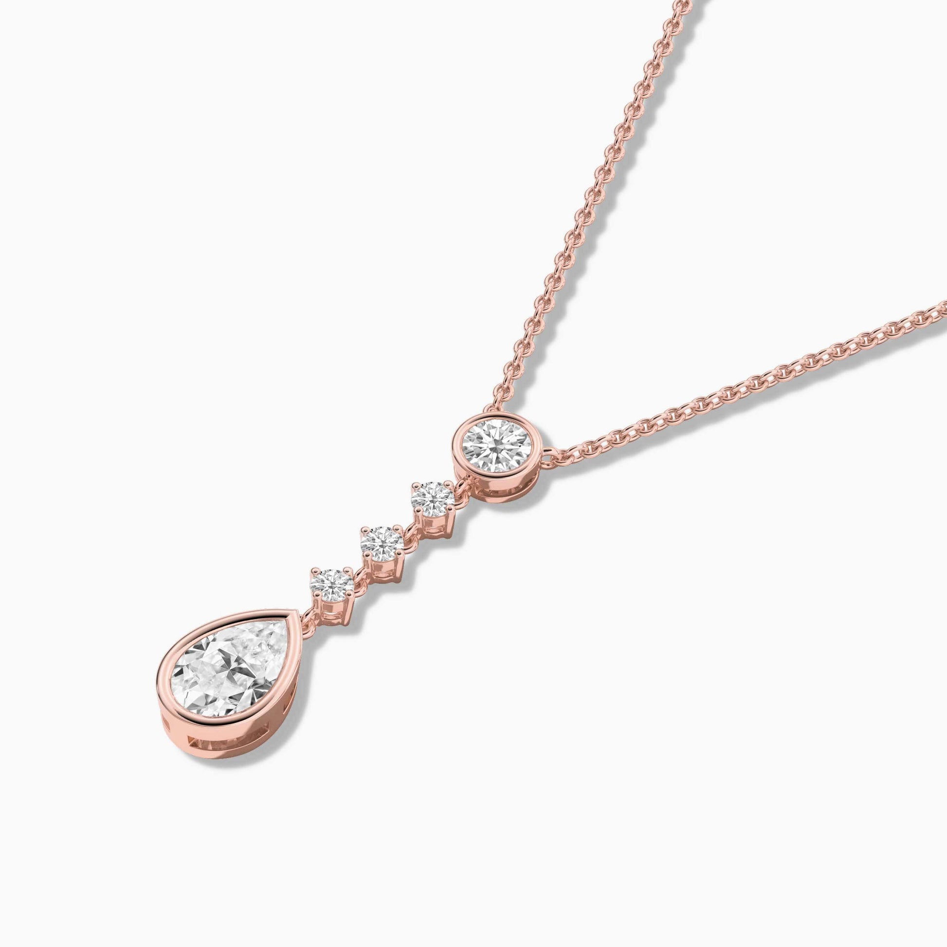 Rose gold necklace with a teardrop-shaped pendant on a white background