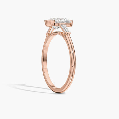 Rose gold ring with a diamond on a white background