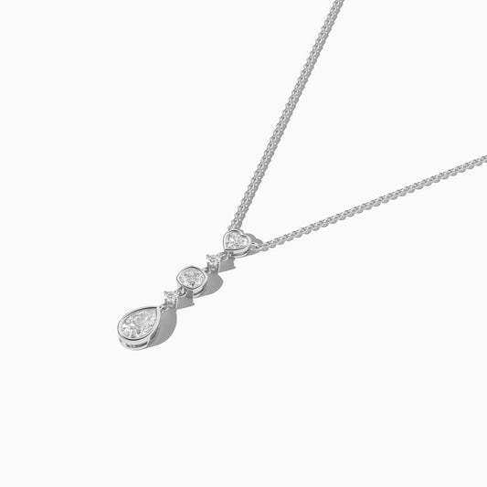 Silver necklace with a teardrop-shaped pendant on a white background