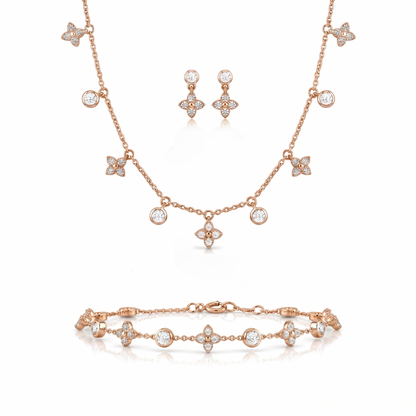 Rose gold jewelry set with necklace, bracelet, and earrings