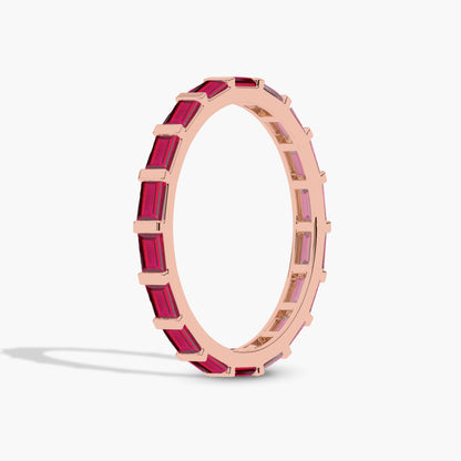 Rose gold ring with red gemstones 