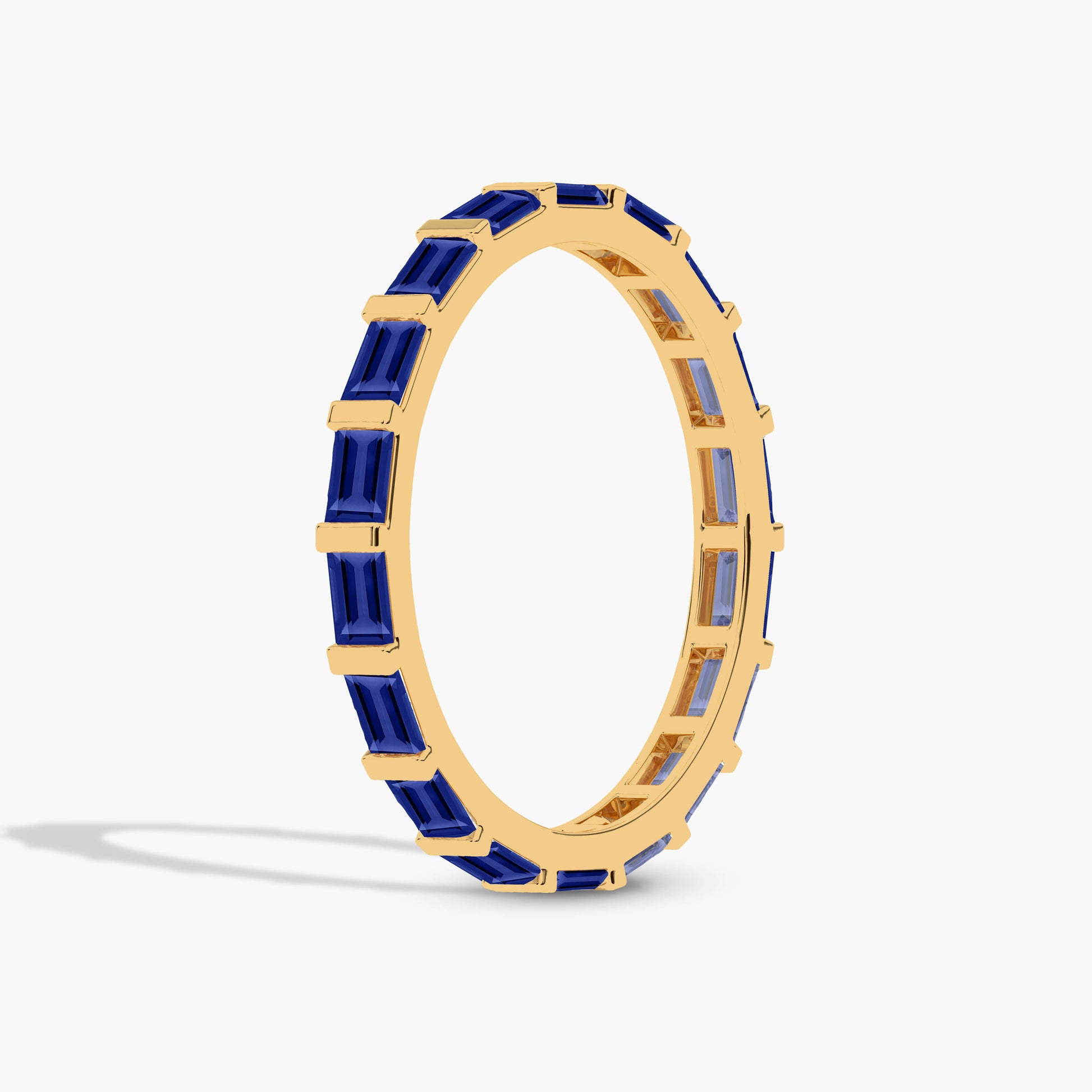 Gold plated ring with blue gemstones 