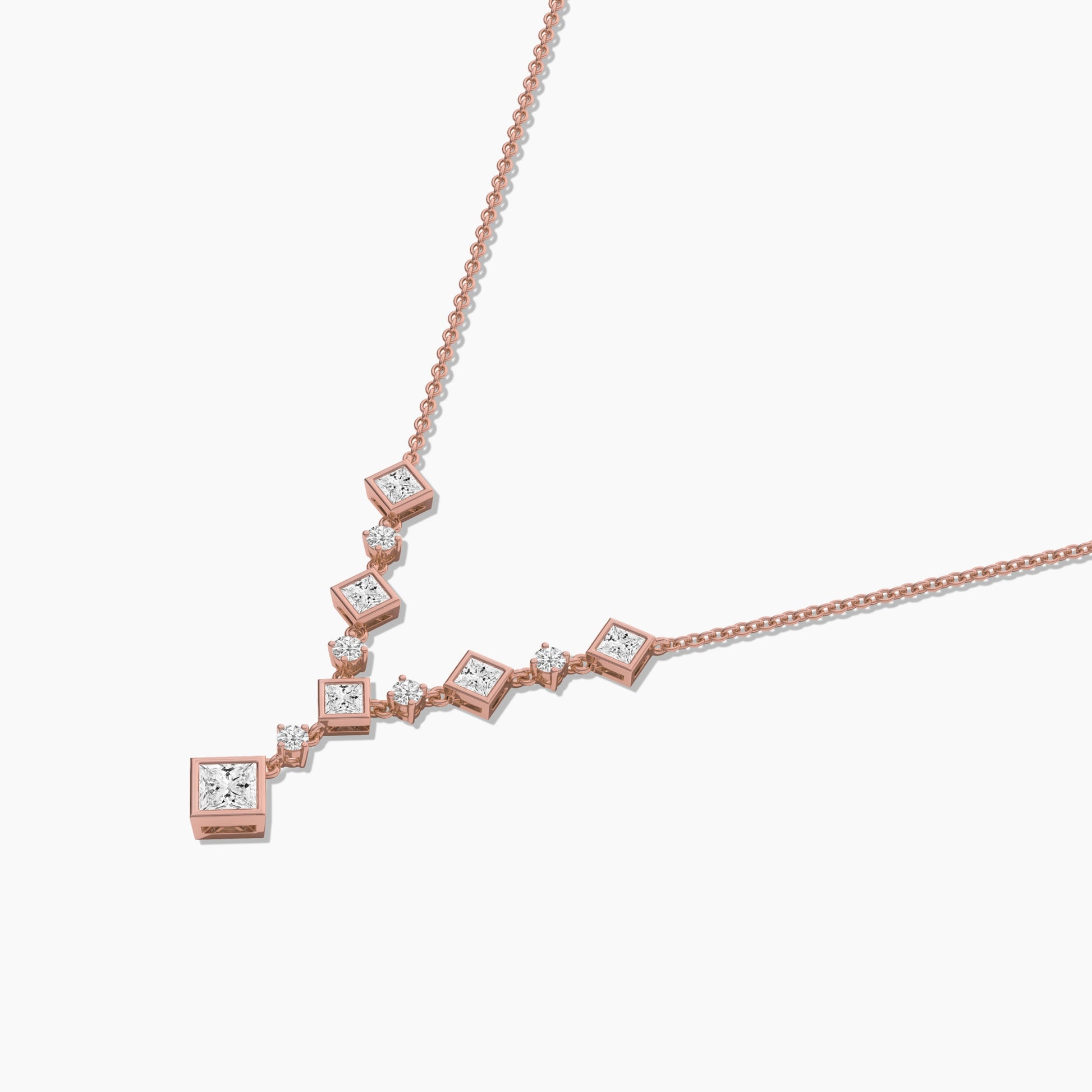 Rose gold necklace with diamond accents on a white background