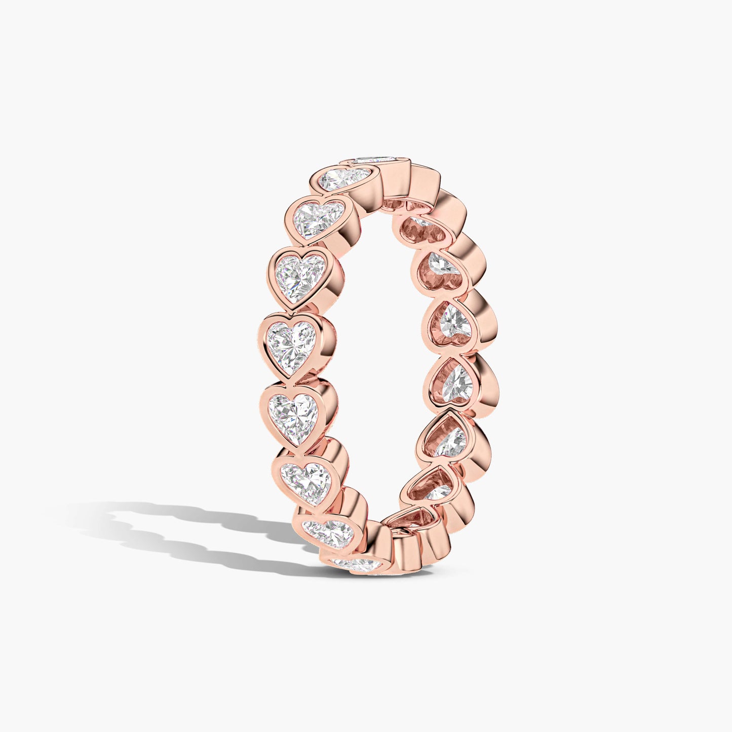 Rose gold ring with heart-shaped diamond stones