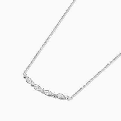 Silver necklace with small diamonds on a white background