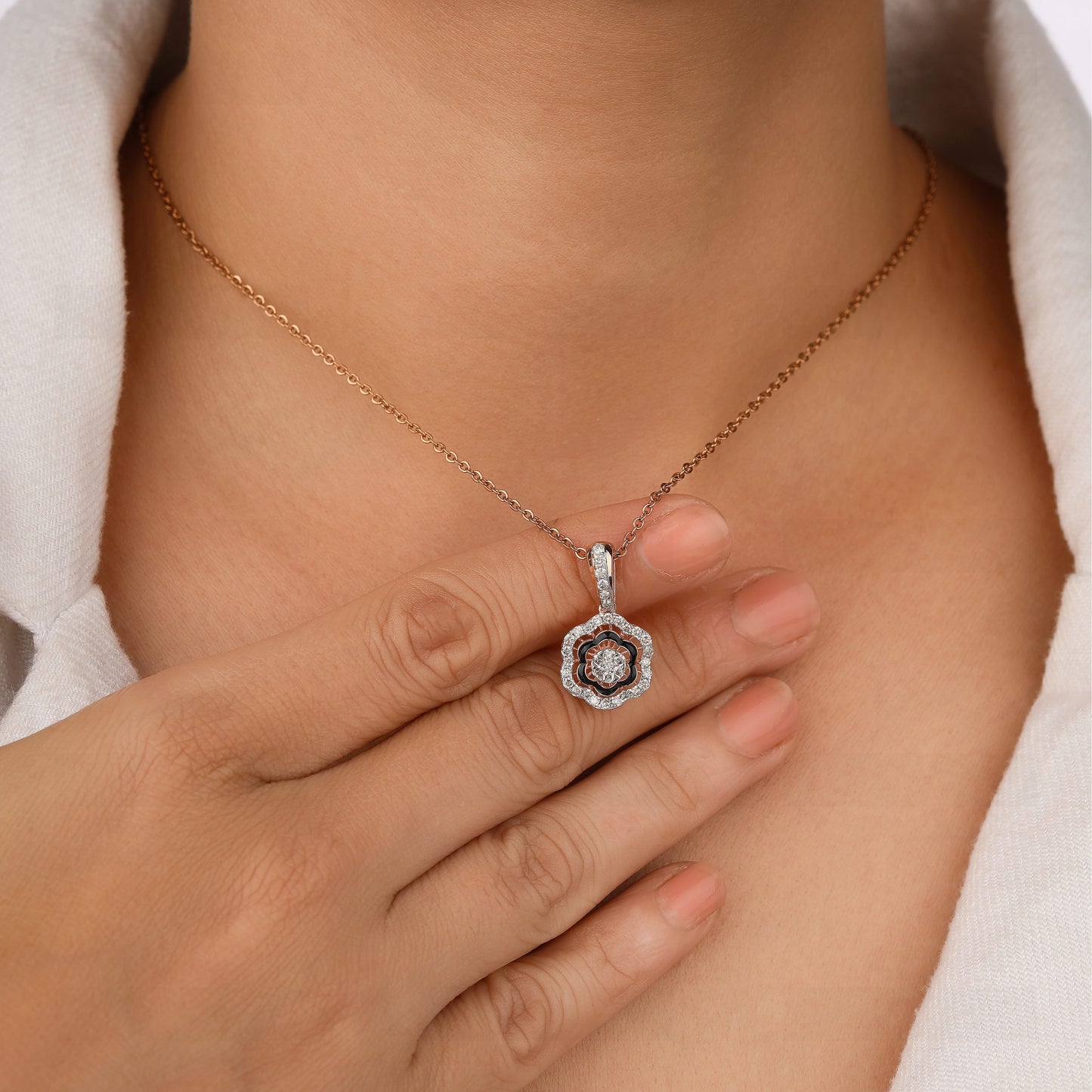 Necklace with a pendant worn by a person