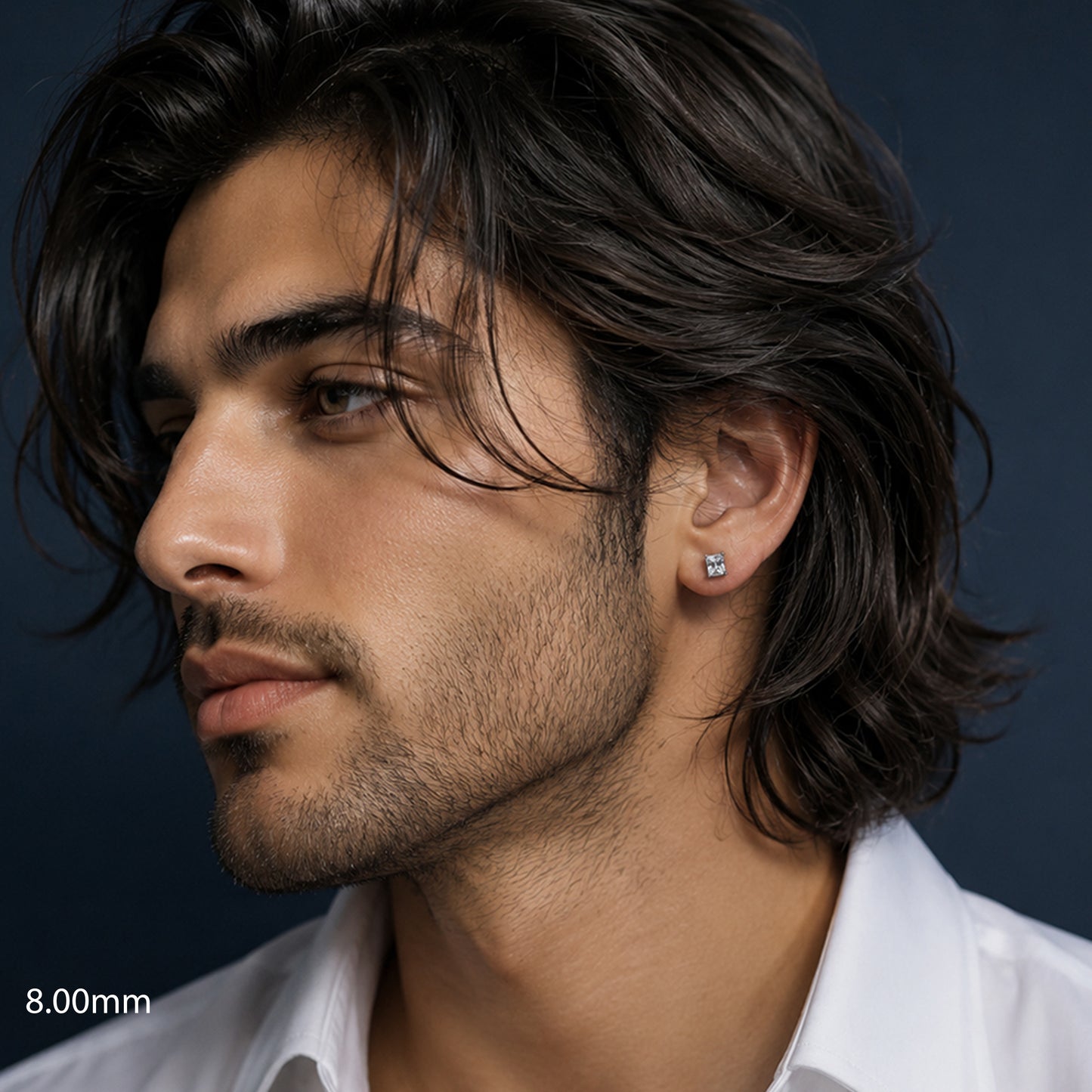 Close-up of a man with styled hair and a white shirt