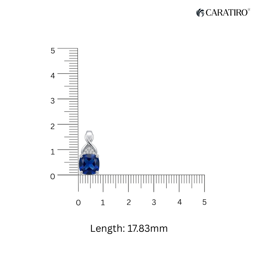 Jewelry pendant with blue gemstone and silver accents