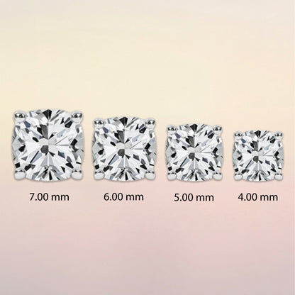 Four diamond stud earrings of different sizes
