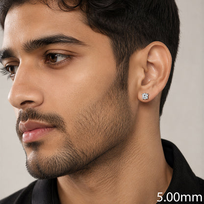A close-up of a man wearing a small round stud earring on his ear