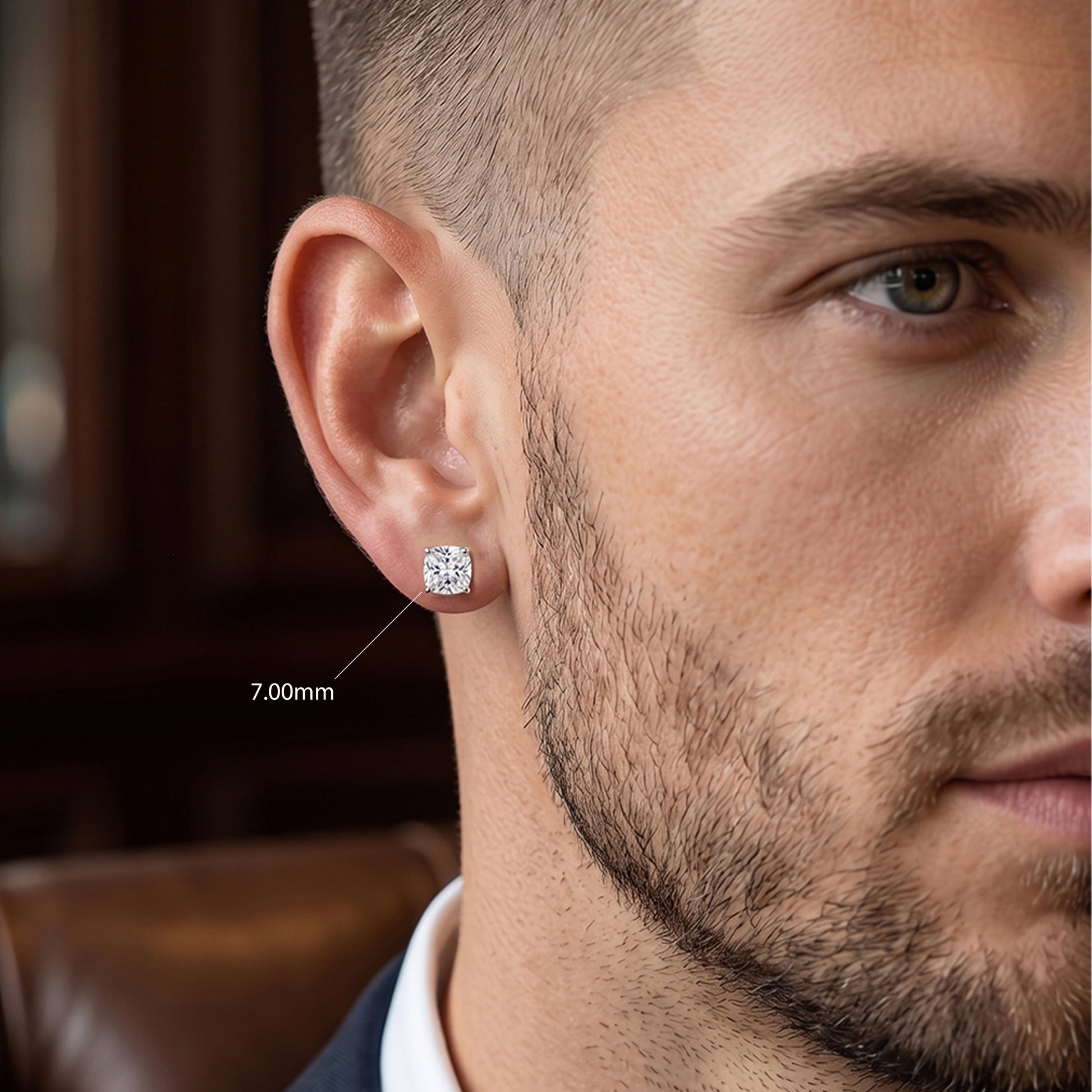 Close-up of a man wearing a diamond earring with a blurred background