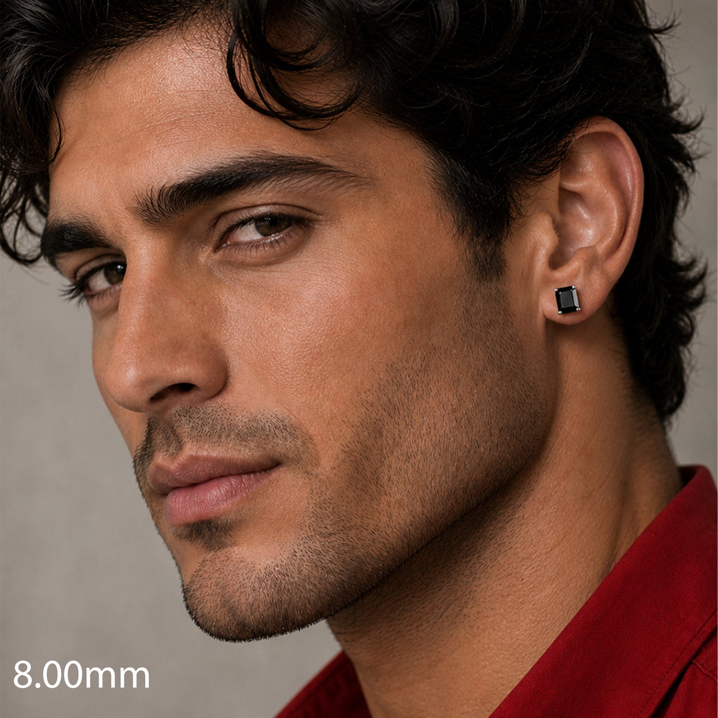 man wearing a black earring with a gray background
