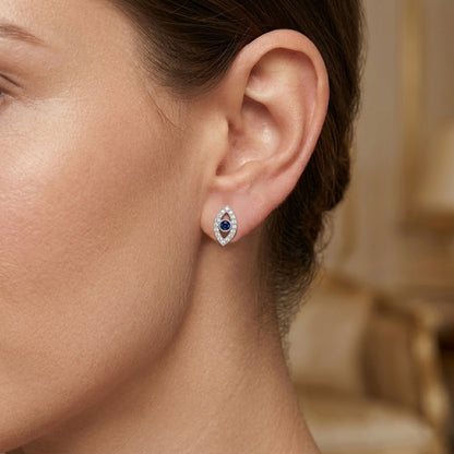 Close-up of a woman's ear wearing a silver earring 